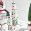 White Bottle Brush Tree with Ornaments on Present